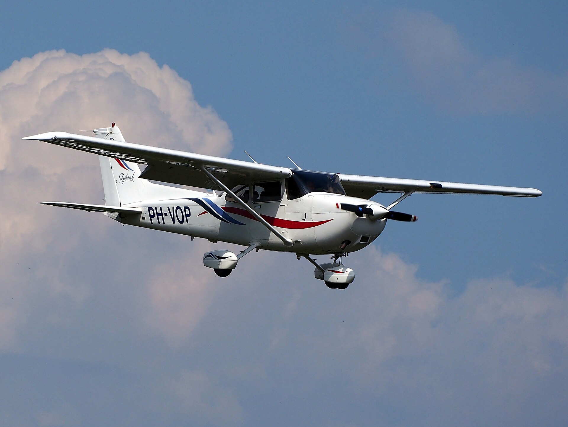 Cessna 172 Skyhawk in flight, high strutted wing and tricycle landing gear