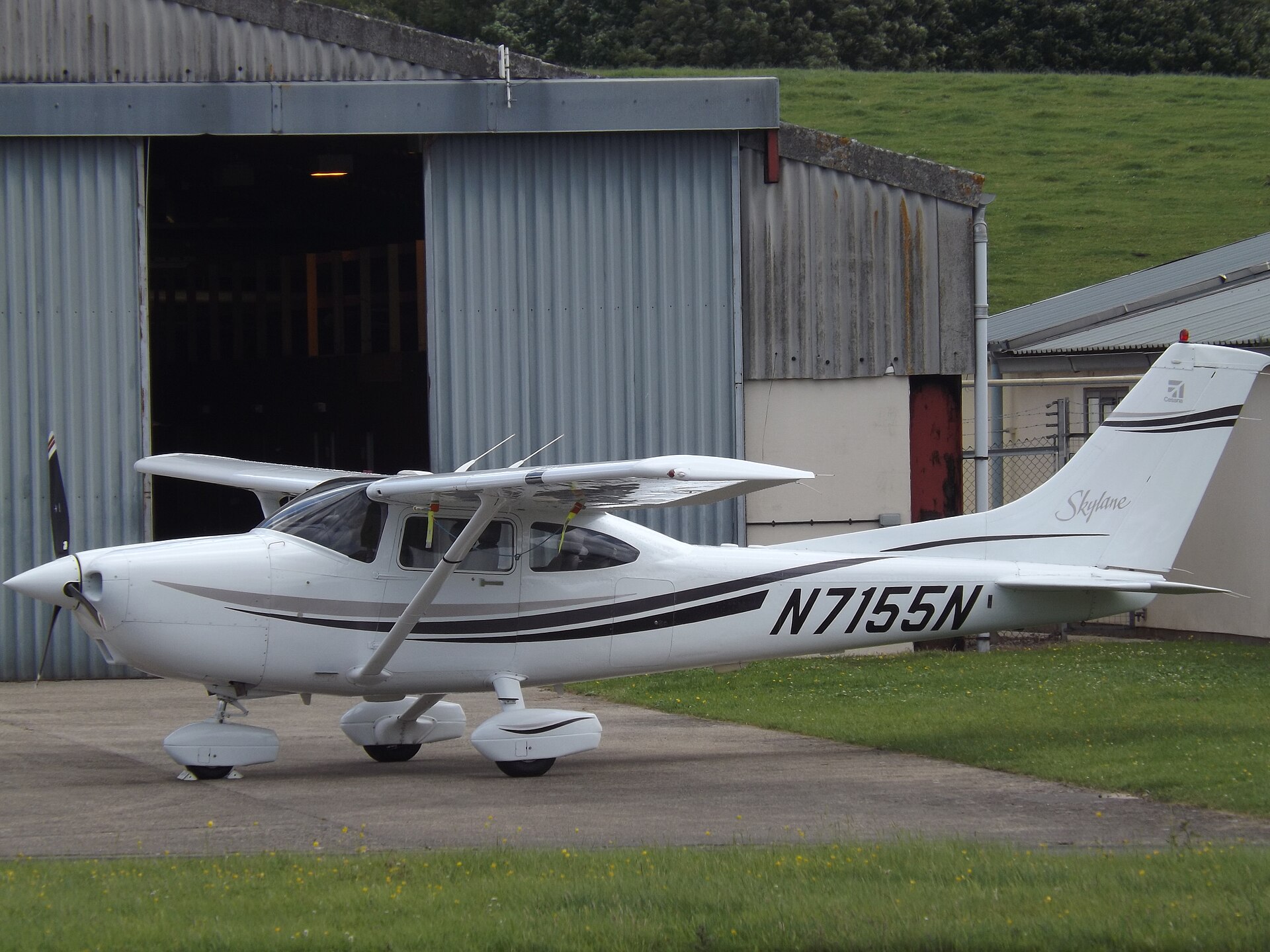Cessna 182 Skylane on the ramp, high strutted wing with Skylane script on the tail