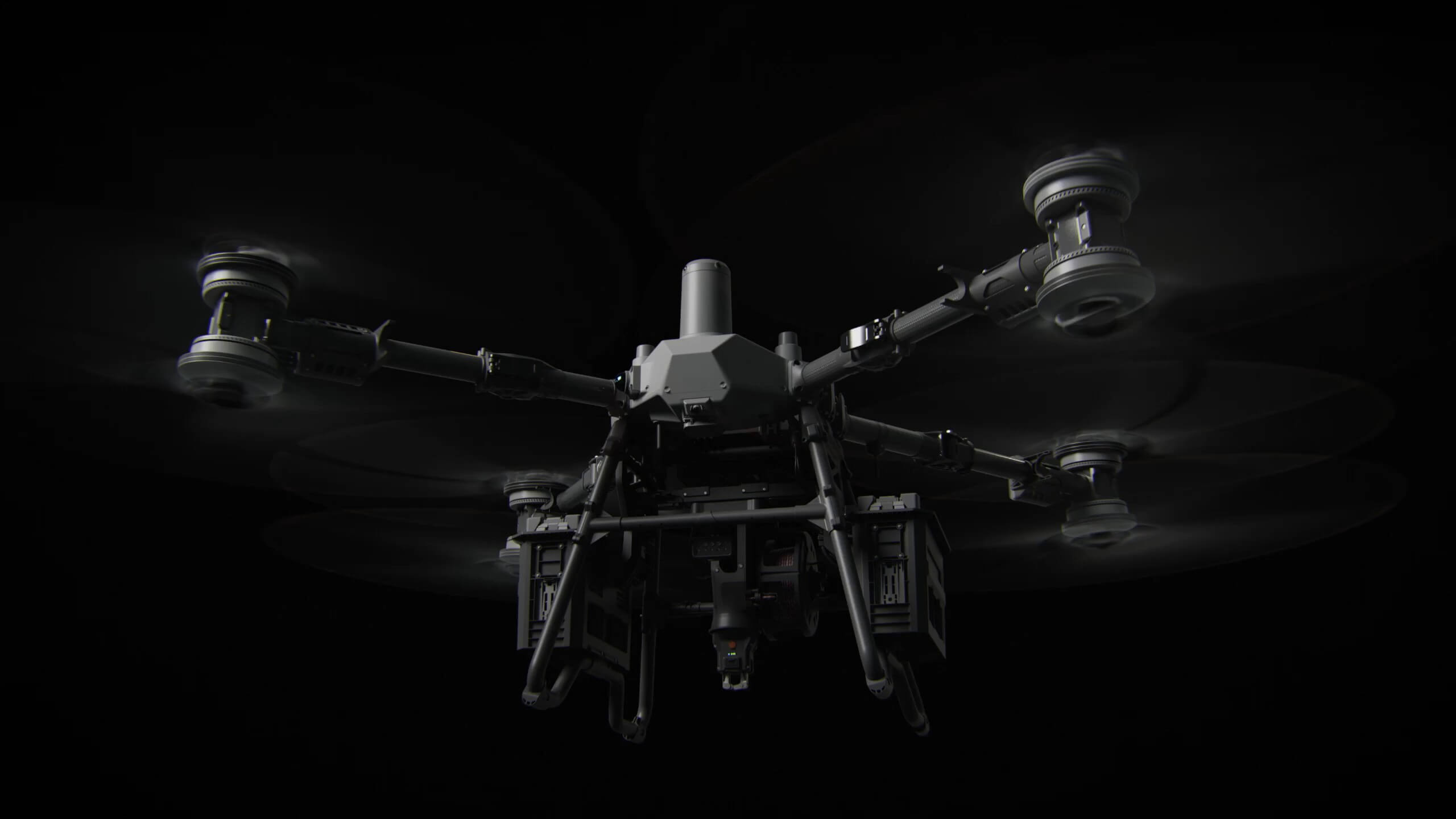DJI FlyCart 100 heavy-lift cargo drone with eight rotors in four coaxial pairs and belly winch unit