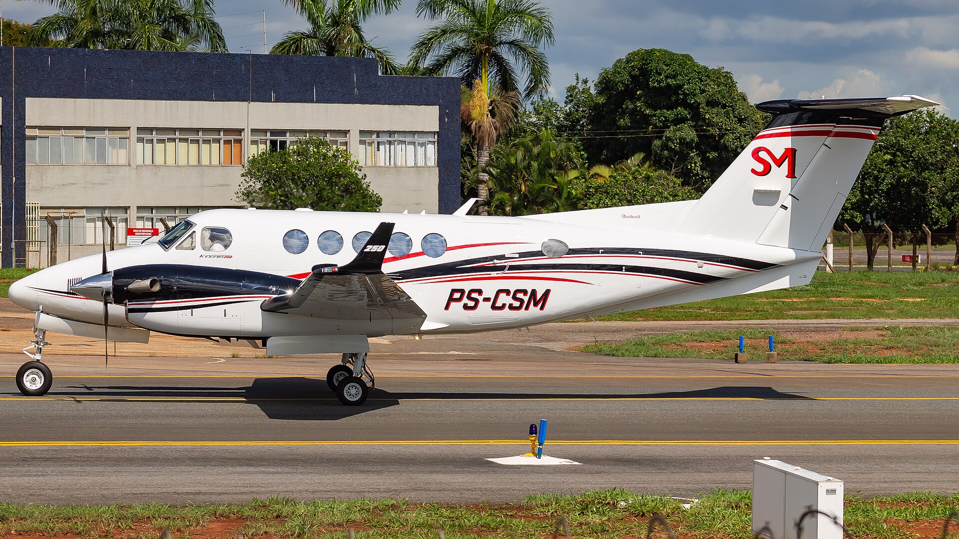 Beechcraft King Air 250 twin turboprop taxiing, T-tail and PT6 nacelles in side profile
